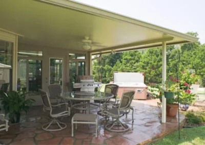 Full wrap metal awning covers the patio and provides a beautiful ceiling for the enjoyment of your family and guests.